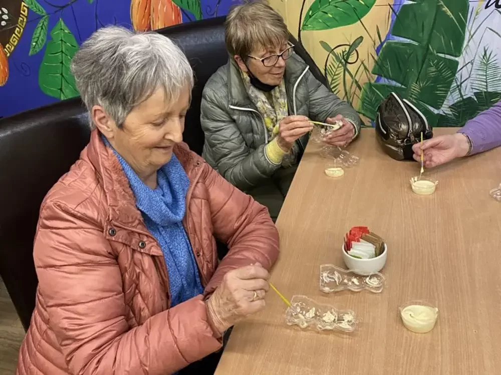 Active Retired group working on their chocolate moulds