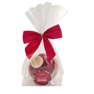 bauble shaped spiced hot chocolatebombe in bag with red bow